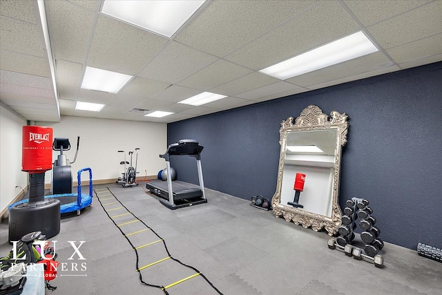 workout room with a drop ceiling