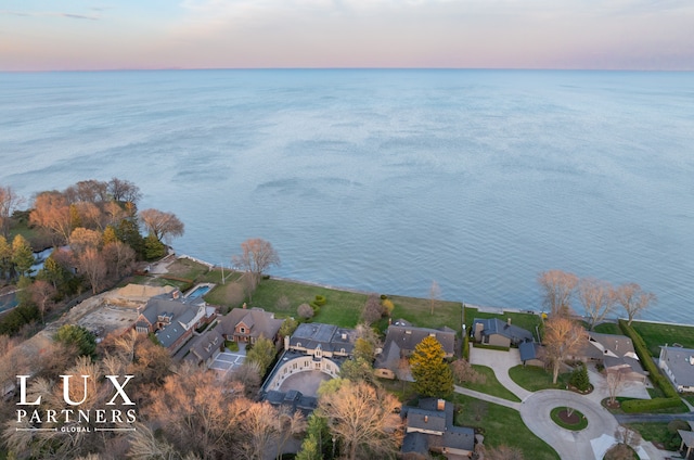 bird's eye view featuring a residential view and a water view