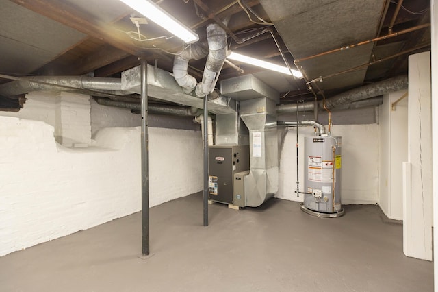 unfinished below grade area featuring gas water heater and heating unit