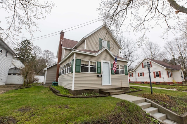 bungalow-style home with a front yard, entry steps, a garage, and a chimney