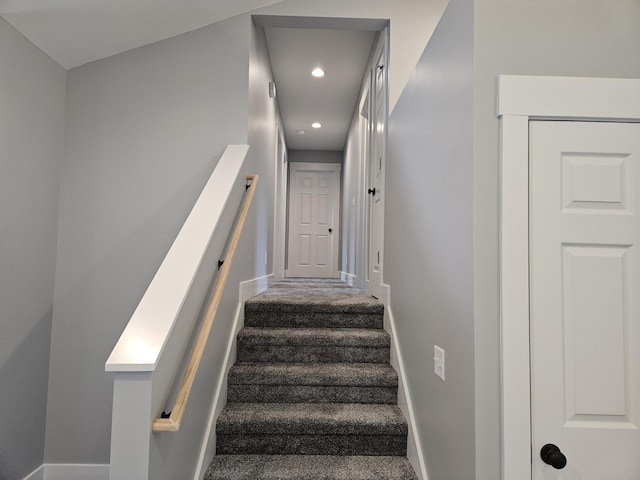 staircase featuring baseboards, recessed lighting, and carpet
