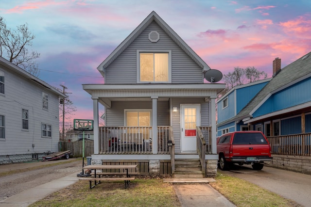 shotgun-style home featuring a porch