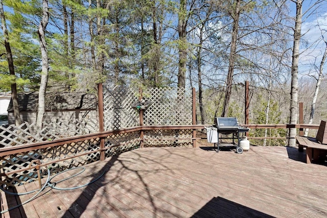 wooden deck with grilling area