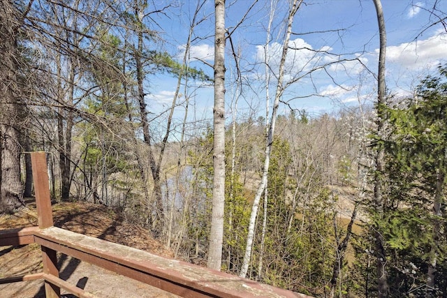 exterior space featuring a view of trees
