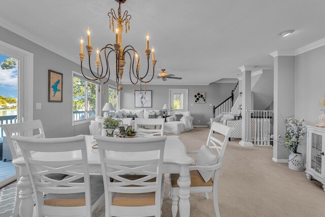 dining area featuring ornamental molding, light colored carpet, a notable chandelier, and baseboards