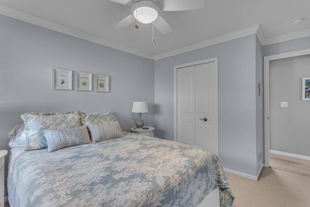 bedroom with light carpet, baseboards, a closet, and ornamental molding