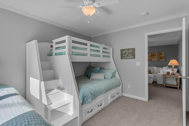 bedroom featuring crown molding, baseboards, a ceiling fan, and light carpet