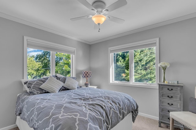 bedroom with carpet, baseboards, ornamental molding, and a ceiling fan