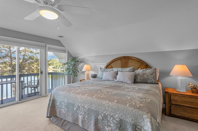 carpeted bedroom featuring visible vents, access to exterior, a ceiling fan, and lofted ceiling