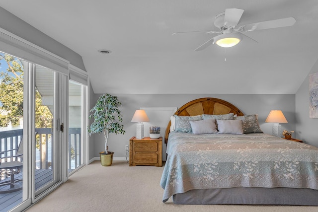 bedroom featuring access to outside, carpet, multiple windows, and vaulted ceiling