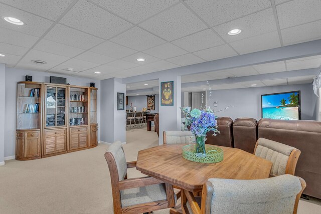 carpeted dining room featuring recessed lighting, a drop ceiling, and baseboards