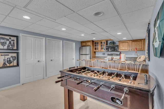 rec room with baseboards, recessed lighting, and carpet flooring