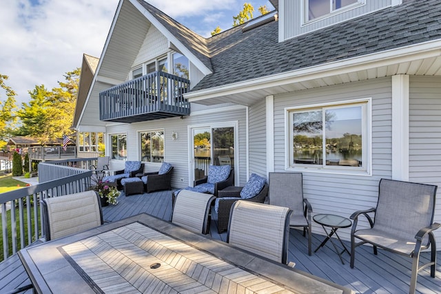 deck featuring outdoor dining area and an outdoor hangout area