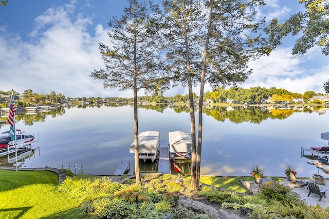 view of dock featuring boat lift and a water view