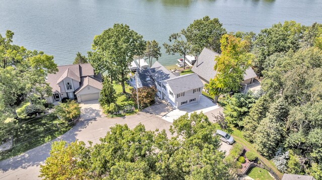 birds eye view of property with a residential view and a water view