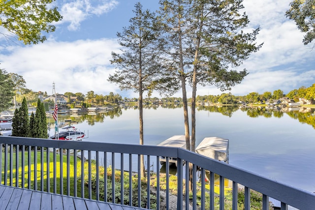 wooden terrace featuring a water view