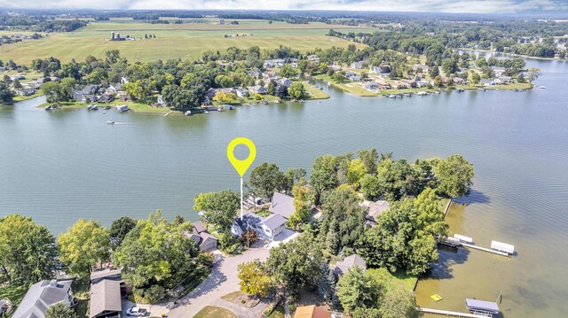 birds eye view of property featuring a water view and a residential view