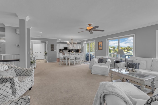 living area with light carpet, baseboards, ceiling fan with notable chandelier, and crown molding
