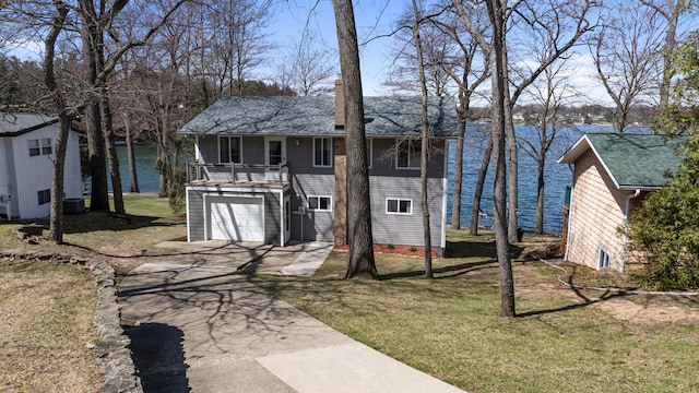 11672 Bradley Dr, Jerome, MI 49249 - exterior space with a water view, driveway, an attached garage, and covered porch