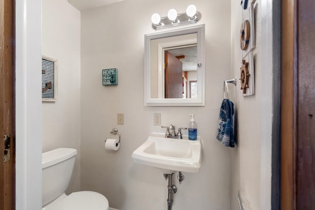 11672 Bradley Dr, Jerome, MI 49249 - half bath featuring toilet and a sink