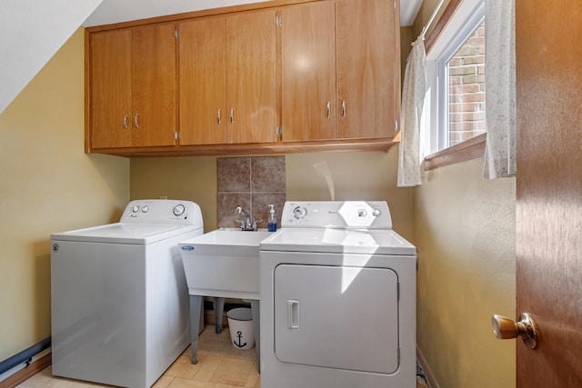 11672 Bradley Dr, Jerome, MI 49249 - laundry area featuring cabinet space and washing machine and dryer