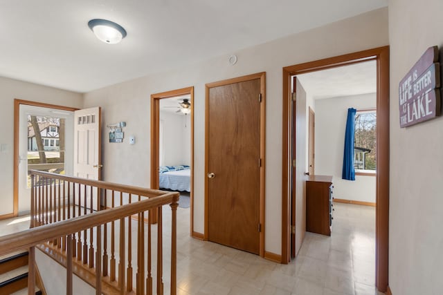 11672 Bradley Dr, Jerome, MI 49249 - hall featuring an upstairs landing, baseboards, and light floors