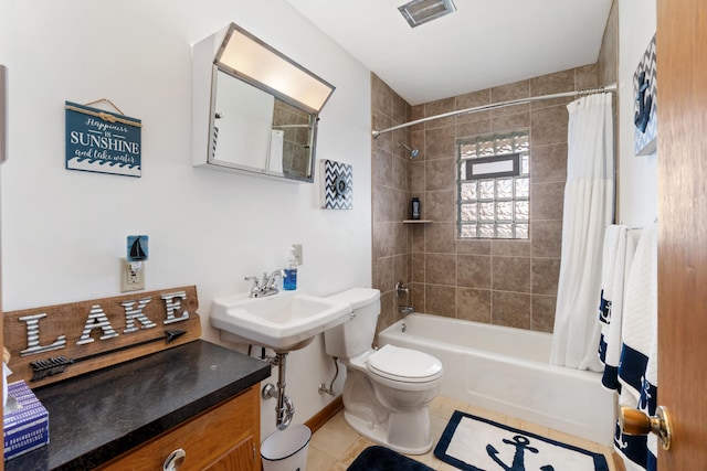 11672 Bradley Dr, Jerome, MI 49249 - bathroom with shower / tub combo, tile patterned flooring, toilet, visible vents, and a sink