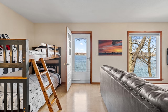 11672 Bradley Dr, Jerome, MI 49249 - bedroom with a water view, baseboards, and light floors