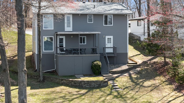 11672 Bradley Dr, Jerome, MI 49249 - back of property with stairs and a lawn