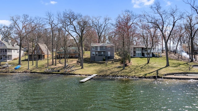 11672 Bradley Dr, Jerome, MI 49249 - view of dock with a water view, a residential view, and a yard