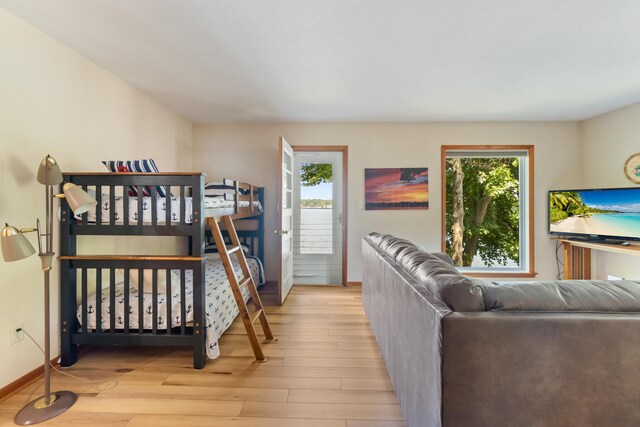 11672 Bradley Dr, Jerome, MI 49249 - bedroom with wood finished floors and baseboards