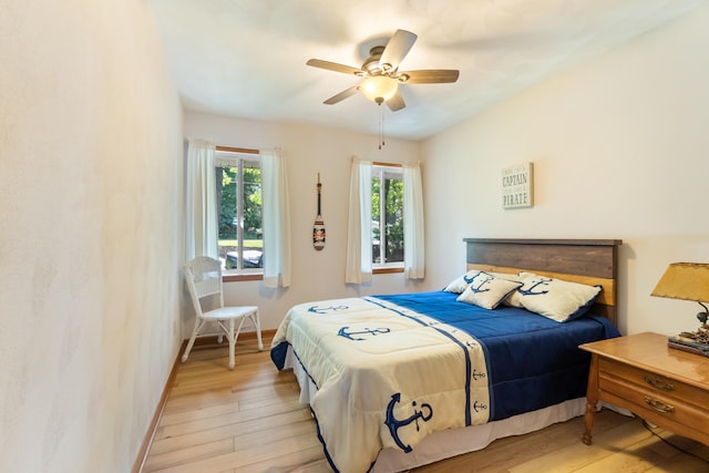 11672 Bradley Dr, Jerome, MI 49249 - bedroom featuring light wood finished floors and a ceiling fan