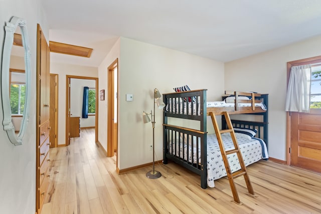 11672 Bradley Dr, Jerome, MI 49249 - bedroom with light wood-style flooring