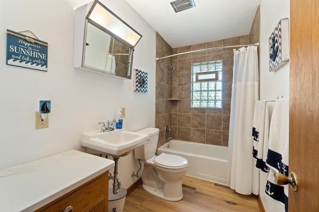 11672 Bradley Dr, Jerome, MI 49249 - full bathroom featuring shower / tub combo with curtain and wood finished floors