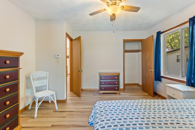 11672 Bradley Dr, Jerome, MI 49249 - bedroom with light wood finished floors and ceiling fan