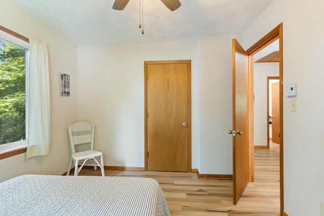 11672 Bradley Dr, Jerome, MI 49249 - bedroom with light wood finished floors and a ceiling fan