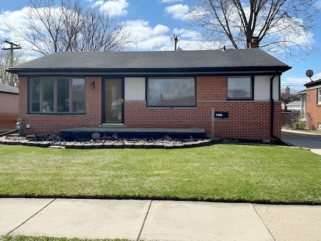 22169 Fairfax St, Taylor, MI 48180 - view of front facade featuring brick siding and a front lawn
