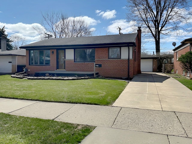 22169 Fairfax St, Taylor, MI 48180 - single story home with a front lawn, brick siding, an outbuilding, and concrete driveway