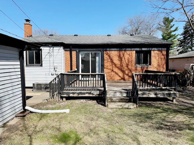 22169 Fairfax St, Taylor, MI 48180 - back of house featuring a yard, brick siding, and a deck