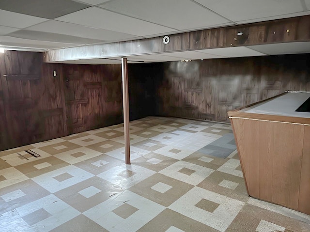 22169 Fairfax St, Taylor, MI 48180 - finished basement featuring light floors, a dry bar, and wooden walls