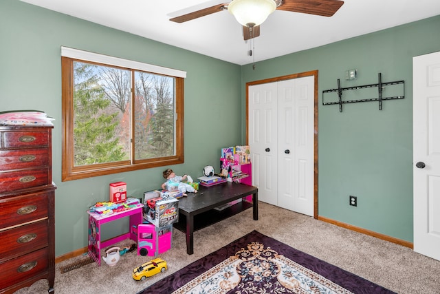 game room featuring a ceiling fan, baseboards, and carpet floors