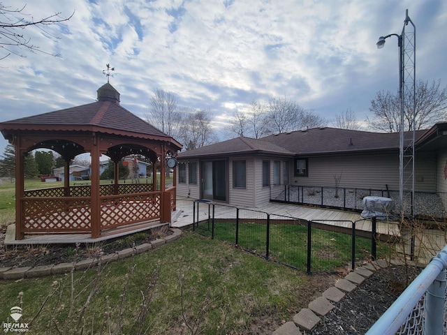 exterior space with a gazebo and fence
