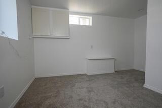 basement with carpet flooring and baseboards