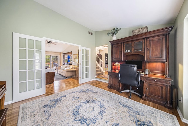 office with visible vents, french doors, baseboards, and wood finished floors
