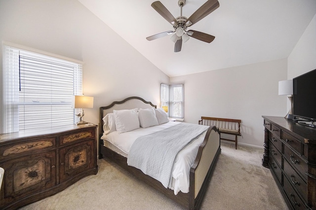 bedroom featuring baseboards, a ceiling fan, light colored carpet, and vaulted ceiling
