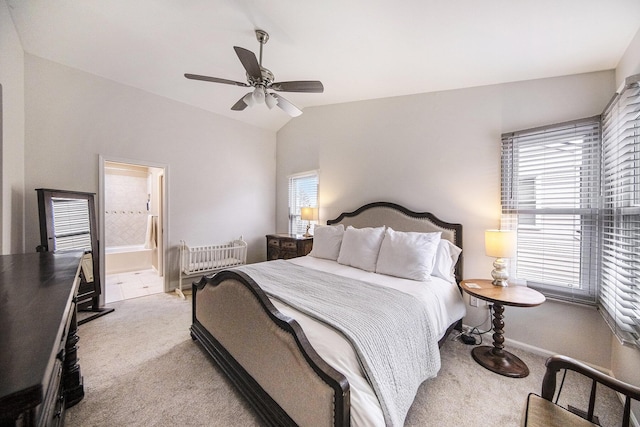 bedroom with light carpet, baseboards, a ceiling fan, and lofted ceiling