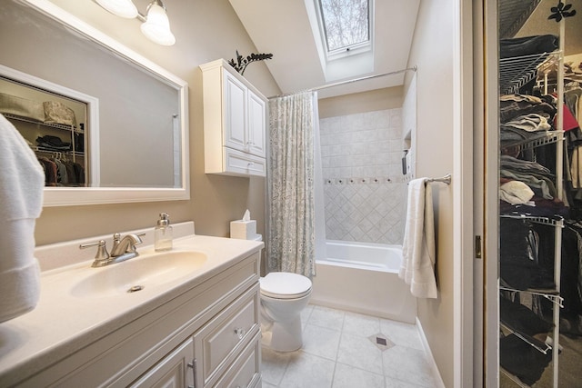 full bathroom featuring shower / tub combo, toilet, a walk in closet, vanity, and tile patterned flooring