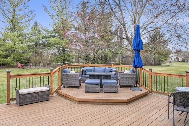 wooden deck with a lawn and an outdoor hangout area