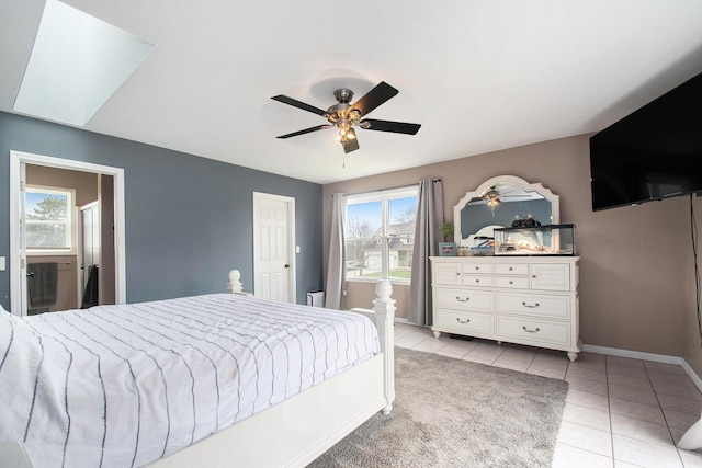bedroom with light tile patterned floors, baseboards, and ceiling fan
