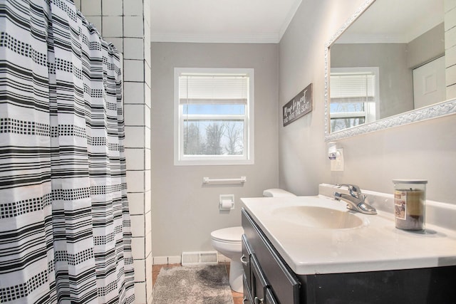 full bathroom featuring a wealth of natural light, vanity, visible vents, and toilet